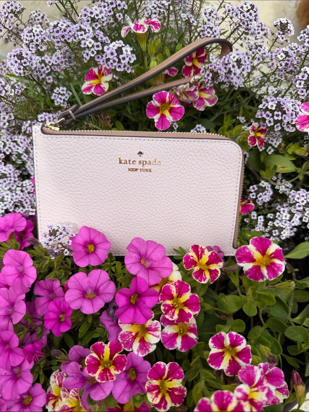 kate spade cream leather wristlet with gold logo NWOT